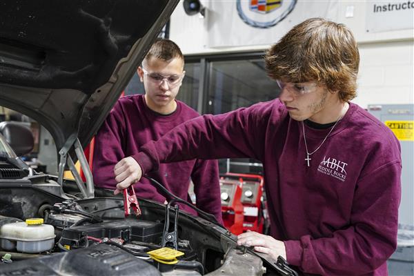 Automotive Technology student working on cars